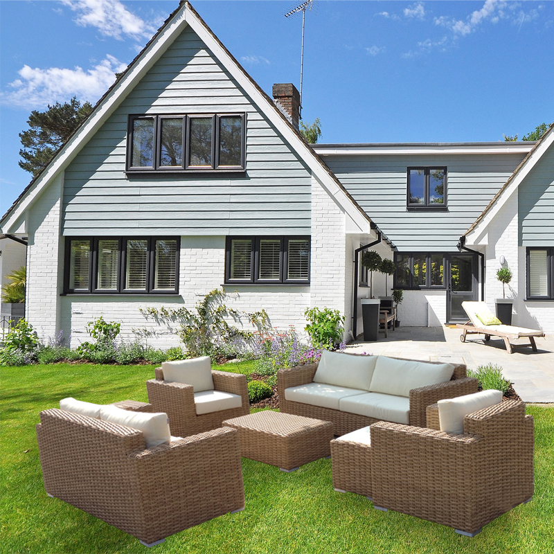 SF26142 rattan sofa set in front of a house