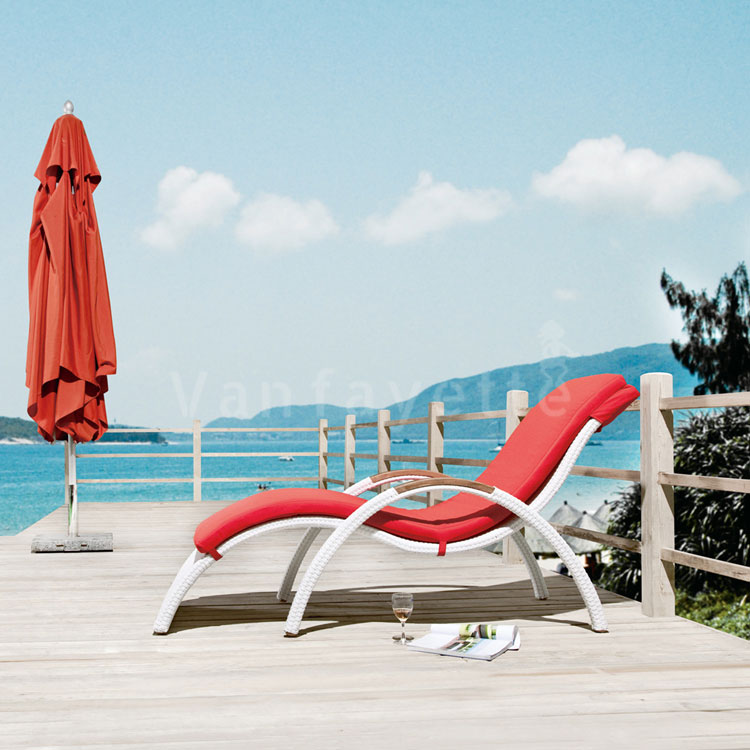 A classic CG sun lounger with a closed umbrella by the sea, illustrating timeless design, durability, and coastal elegance