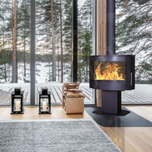 oval free standing log burner with panoramic glass, compact central fire place for small apartments and eco friendly heating solutions