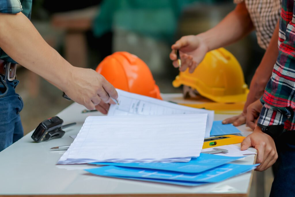 Hotel project coordination and quality control process, showing teams reviewing documents and specifications as part of outdoor furniture supplier evaluation and project planning.